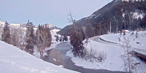 Road in the mountains, bridge over the river Hoback Webcam