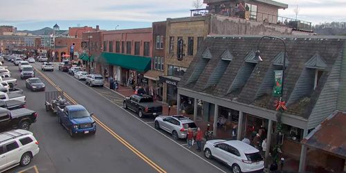 Cars, pedestrians, shops and restaurants on King Street Webcam