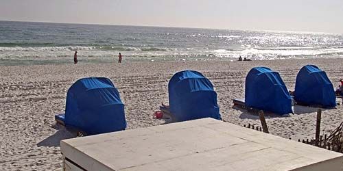 Vacationers on a sandy beach live cam